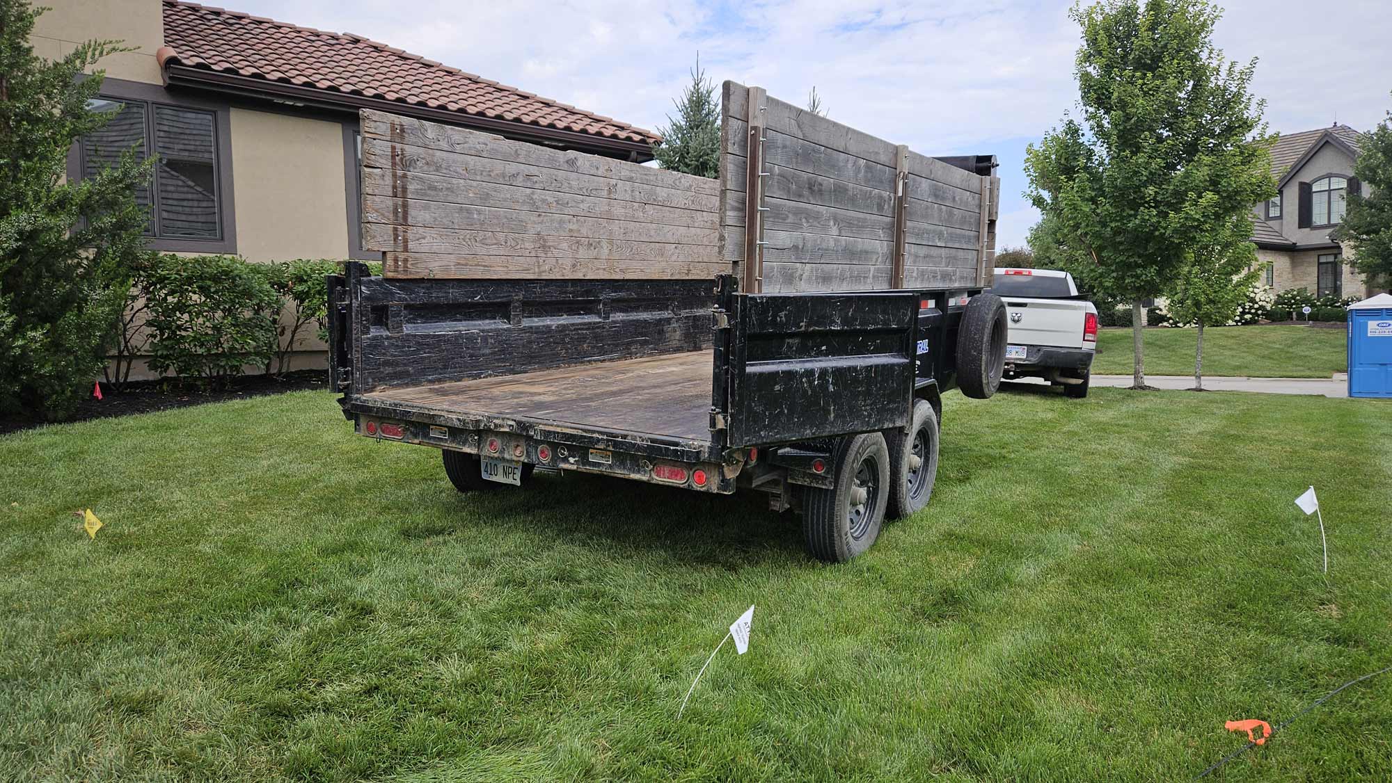 Blue Cord Dumpster Rental Avoiding inground sprinklers