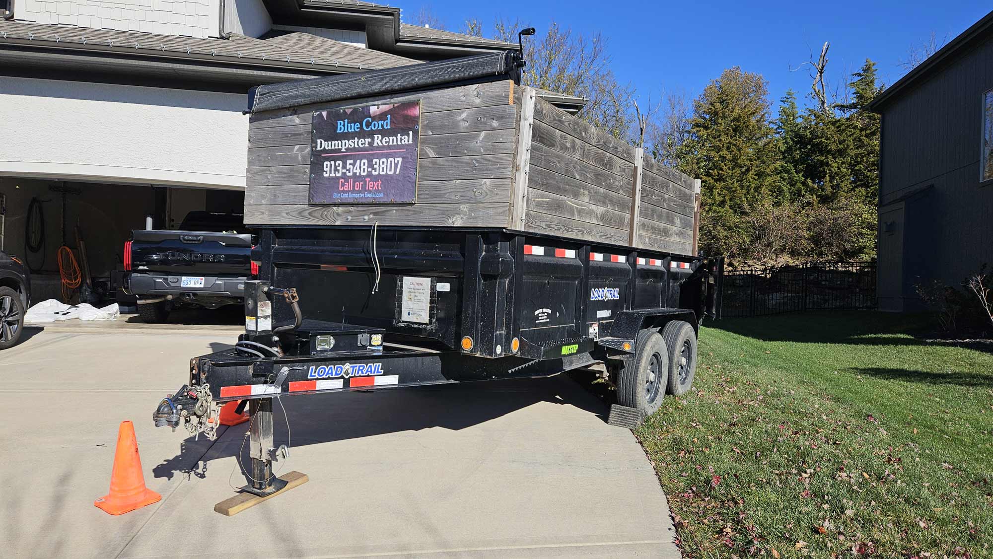 Blue-Cord-Dumpster-Rental-cattycorner-off-driveway