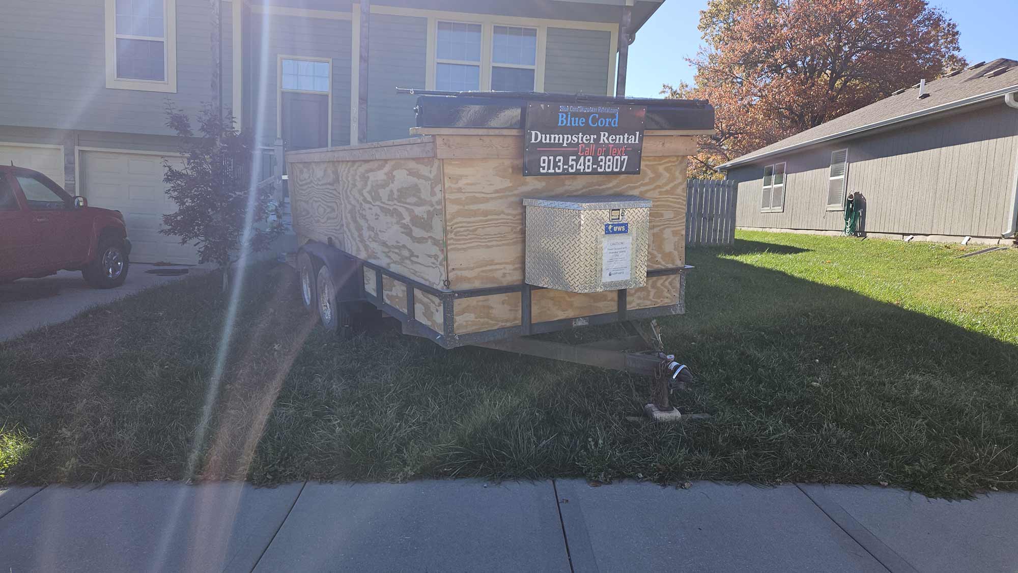 Blue-Cord-Dumpster-Rental-delivery-tofront-door-3